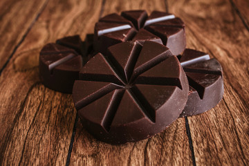 chocolate mexicano, cinnamon sticks and mexican chocolate from oaxaca mexico on wooden in rustic style