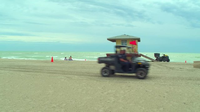 Lifeguard stand reveal behing palm tree Hollywood Beach