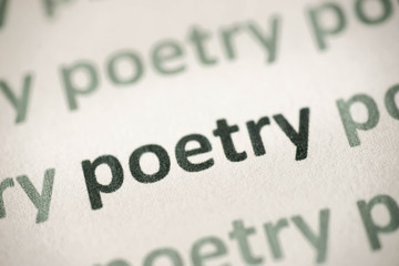 word poetry printed on paper macro