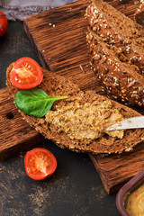Liver pate with rye bread and cherry tomatoes. Selective focus.