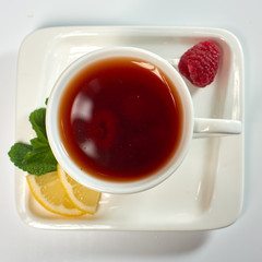 Raspberry tea./Tea with raspberries, lemon and mint. Hot drink.