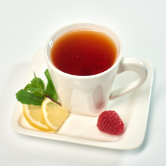 Raspberry tea./Tea with raspberries, lemon and mint. Hot drink.