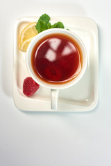 Raspberry tea./Tea with raspberries, lemon and mint. Hot drink.
