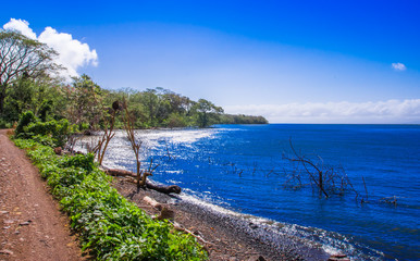 Fototapeta premium Beautiful outdoor view of seashore of the ocean at Isla Ometepe in Nicaragua. surrounding of nature in Ometepe island