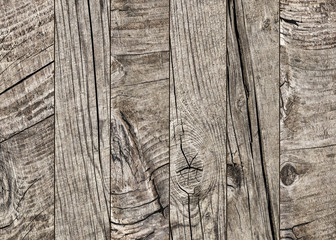 Photograph of old weathered cracked knotted Pine wood floorboards grunge texture detail