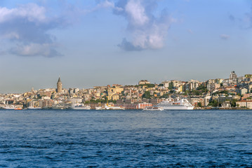 Fototapeta na wymiar Istanbul, Turkey, 30 July 2007: The Galata Tower and ships in the Karakoy district of Istanbul.