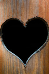 The heart on the toilet door. Heart carved on the toilet door