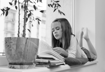 The girl is reading a book.