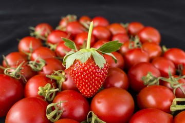 tiny cherry tomatoes and strawberries, colors, tastes the same but different,

