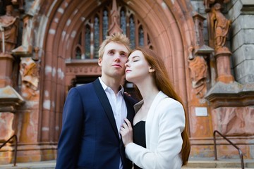 Fototapeta premium fashion portrait of beautiful young couple posing outdoors