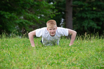 a  boy's doing push-ups