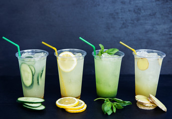 Lemonade with four different tastes on the black background