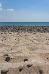 Vertical photo of the sea landscape with the beach.