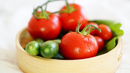 fresh organic vegetable. Tomatoes, cherry tomatoes, cucumber with white background