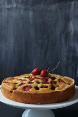 Strawberry cake on a black background