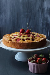 Strawberry cake on a black background