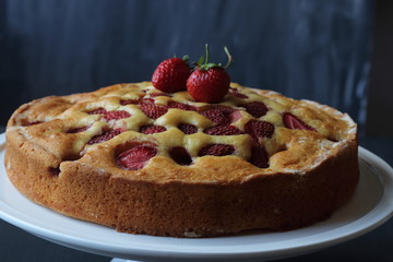 Strawberry cake on a black background