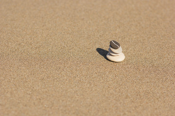 Fototapeta na wymiar Balanced several Zen stones on the beach background