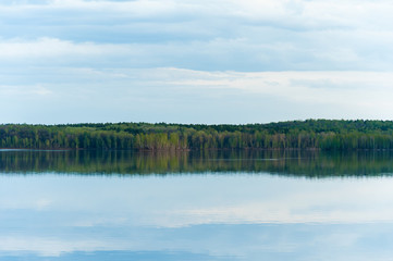 beautiful, picturesque nature. The lake is surrounded by forest.