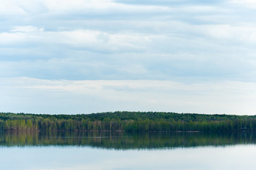 beautiful, picturesque nature. The lake is surrounded by forest.