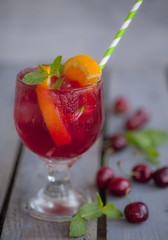 Red alcohol cocktail with berries 