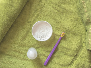 dentifrice and tooth rinse with toothbrush on the towel
