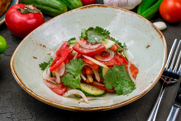 Vegetable salad with tomatoes and cucumbers