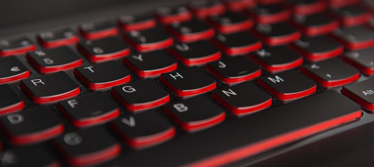 keyboard texture pattern macro. Closeup of laptop keyboard illumination, backlit keyboard