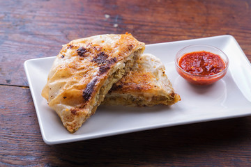 Moroccan chicken in fill pastry with tomato dip