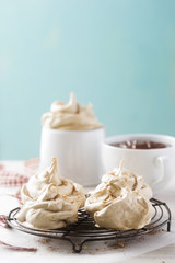 Coffee meringues with chocolate sauce