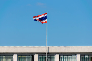 Thailand flag at cityhall in bright sky.