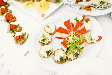 catering table set service with silverware and glass stemware at