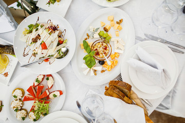 delicious dishes on the table in the restaurant. serving table.