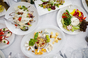 delicious dishes on the table in the restaurant. serving table.