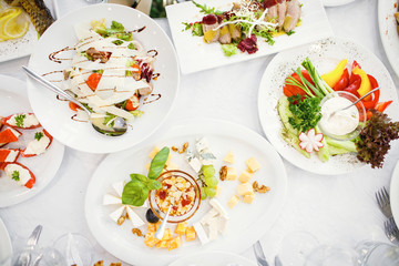 Catering table set service with silverware and glass stemware at