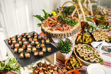 table with different type of snacks preparing for party.