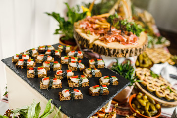 Beautifully decorated catering banquet table with different food