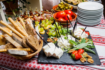 table with different type of snacks preparing for party.