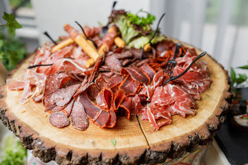 table with different type of snacks preparing for party.