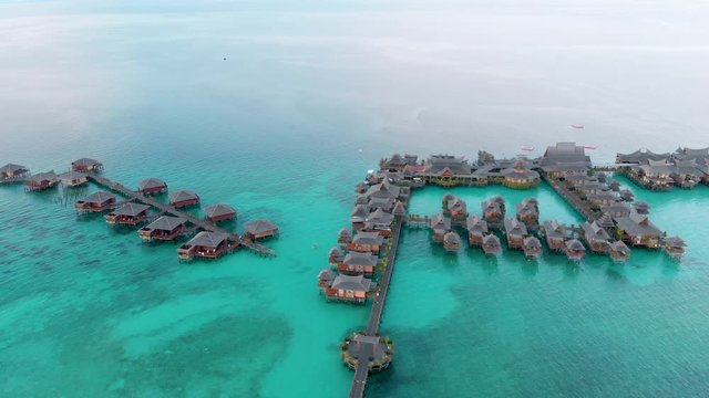 Aerial panoramic view of some floating resorts of Mabul. One of the most beautiful dive spots in the world. Shot in 4k.