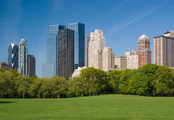 Fototapeta na wymiar Sheep Meadow in Central Park with Central Park West skyline