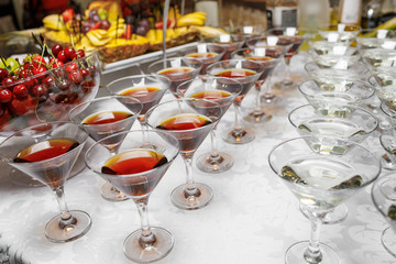 Many glasses of colorful Cocktails on the table
