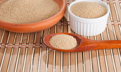Raw Organic Amaranth grain on wooden table