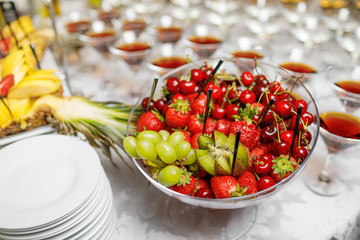 Wedding reception, decor table of fruits and caces