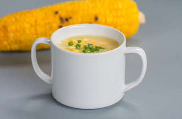 Corn soup in white bowl