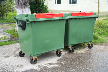 Big green recycling containers on the street