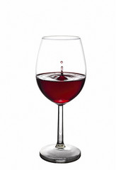 splash of red wine in a glass	
