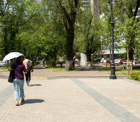 woman with umbrella against the sun