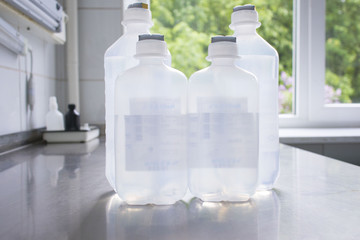 bottles with solutions on the medical table