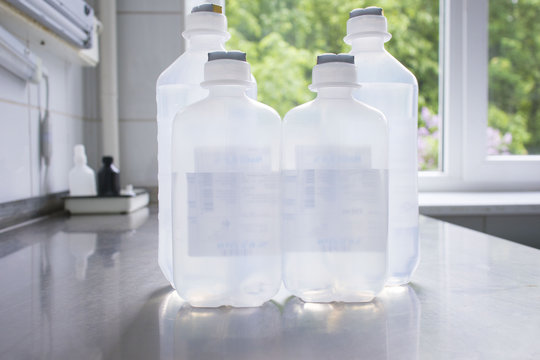 bottles with solutions on the medical table